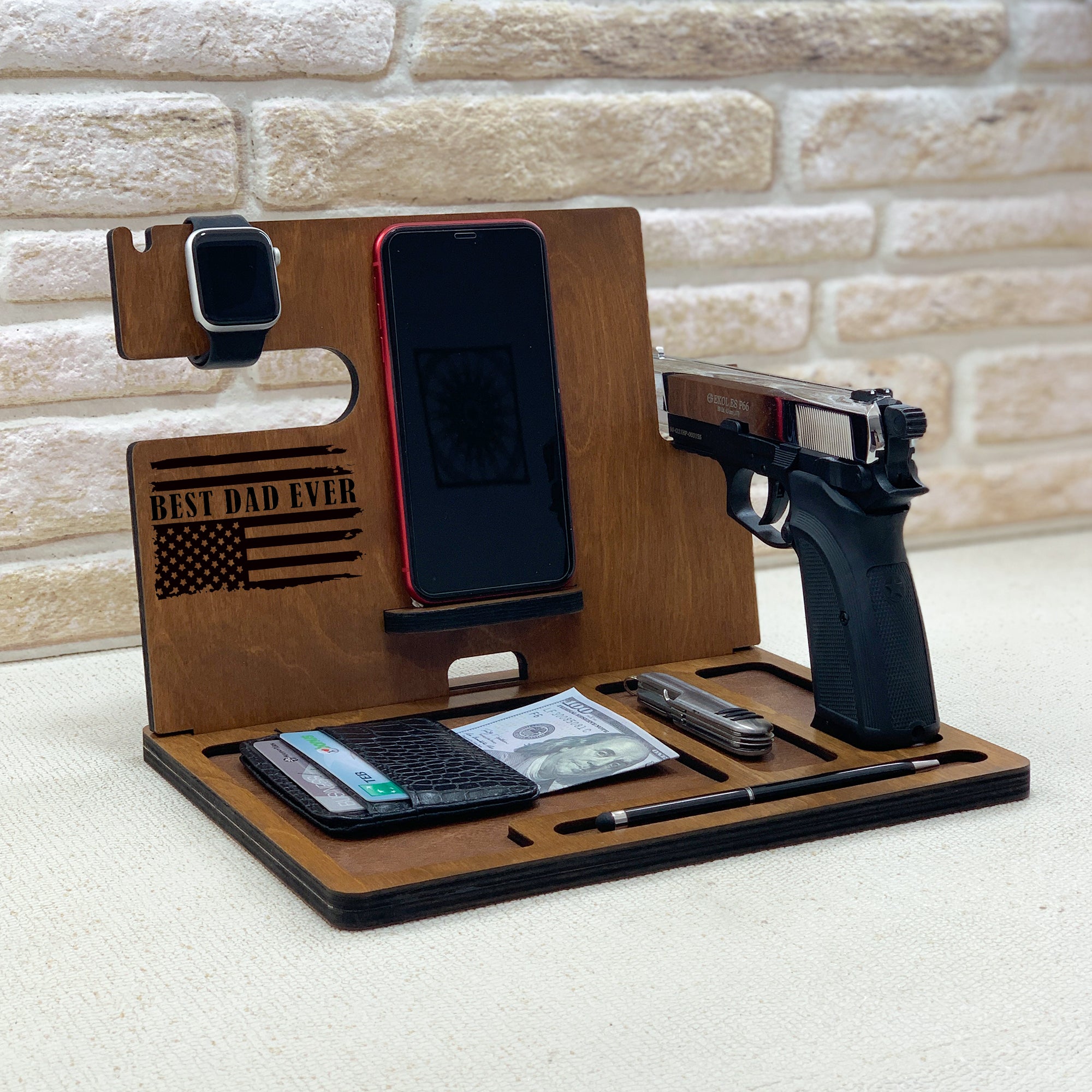 Personalized wooden nightstand valet with custom engraved with Best Dad Ever. Personalized gifts for police officer which include holders for an Apple Watch, smartphone, wallet, pen, and a dedicated slot for a handgun. The stand is organized to keep everyday carry items neatly in place. ideal gifts for law enforcement, police retirement and the one who have gun.