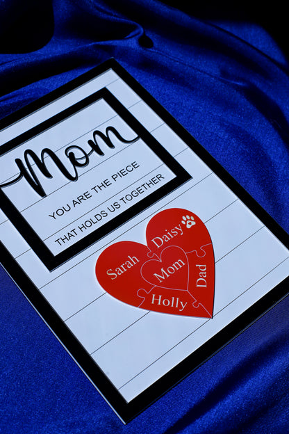 Close-up detail of the engraved puzzle pieces on the personalized Mom sign