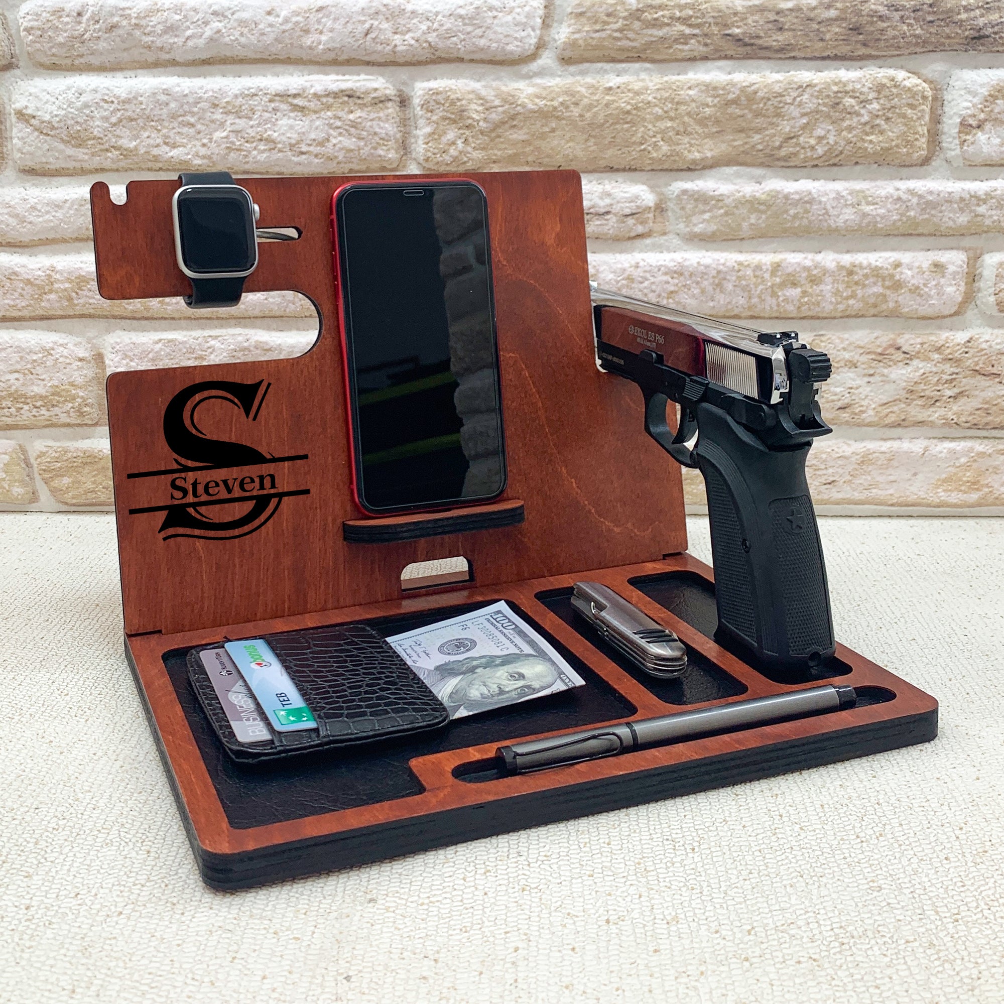 Personalized wooden nightstand valet with custom engraved with name. Personalized gifts for police officer which include holders for an Apple Watch, smartphone, wallet, pen, and a dedicated slot for a handgun. The stand is organized to keep everyday carry items neatly in place. ideal gifts for law enforcement, police retirement and the one who have gun. 