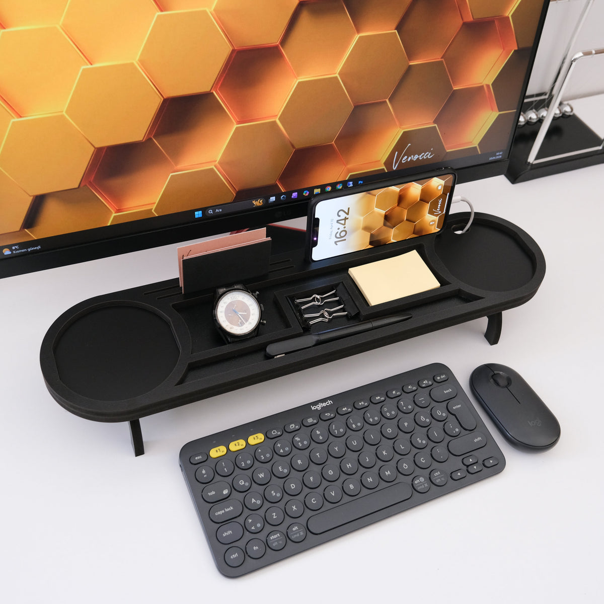 Black desk organizer with phone stand, valet tray, card holder and clip compartment