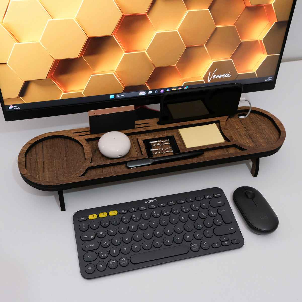 Brown desk organizer showing the phone stand with cable access, card slot, clip tray and note space